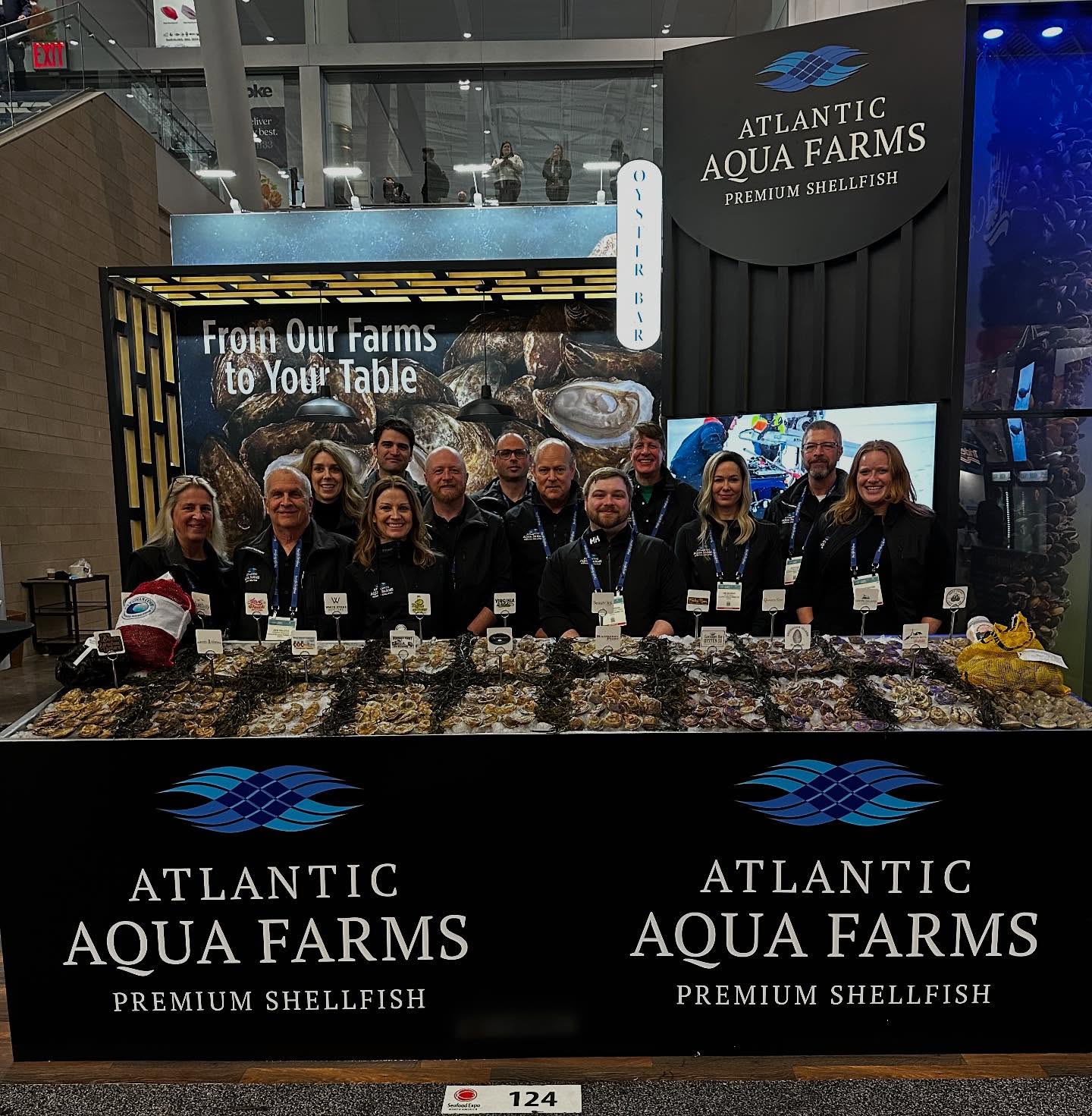The full Atlantic Aqua Farms team at the Seafood Expo booth